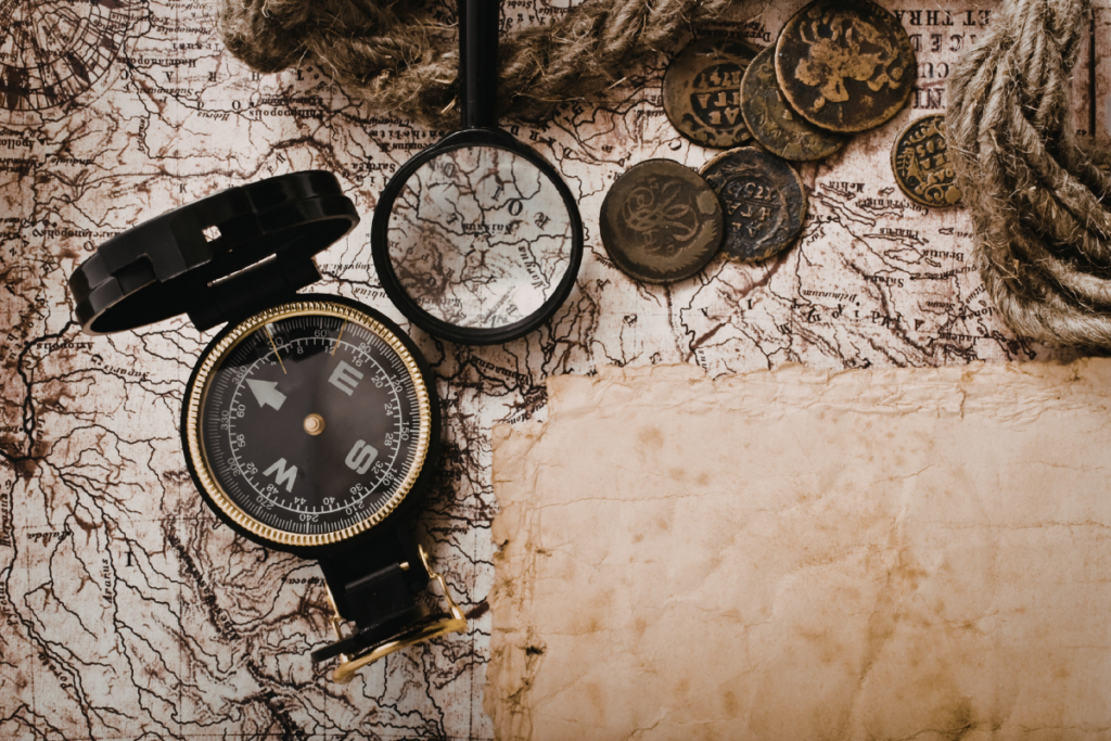 Vintage compass resting on an old world map, symbolizing guidance and direction in navigating global trade.
